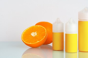 Vape liquid with orange flavor on white background