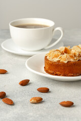 Tart pie with almond petals on plate