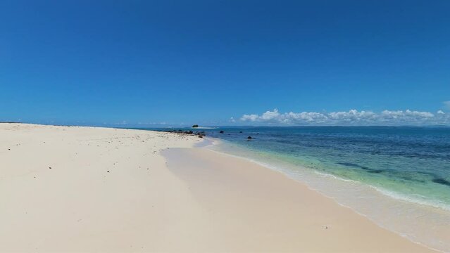 Powdery beach with ocean waves. Naked Island. Surigao del Sur, Philippines.