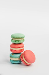 multi-colored macaroons on a white background