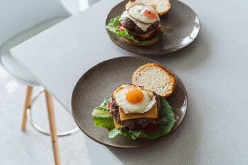Delectable homemade cheeseburger garnished with a perfectly fried sunny-side-up egg