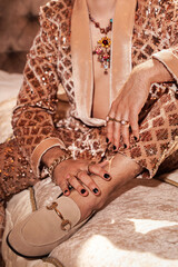 Rich man, dressed in a shimmering golden suit and wearing golden jewelry