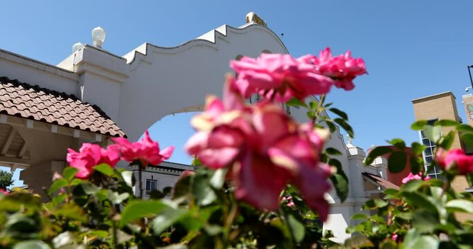 Lodi, California, USA - July 16, 2021: Afternoon sunlight shines on the historic bell arch way in downtown Lodi.