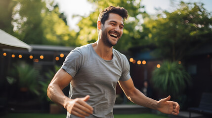Portrait of a Smiling Man Dancing in the Backyard
