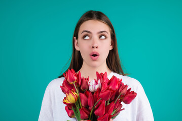 Beauty girl with tulip. Beautiful sensual woman hold bouquet of tulips, studio portrait.