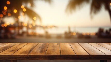 Wooden table and blur beach cafes background. - obrazy, fototapety, plakaty