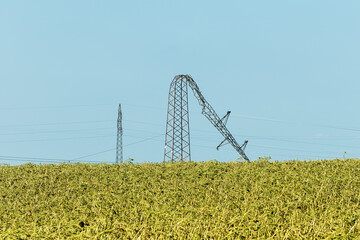 Bent over electricity pylon after strong summer storm