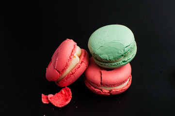 crushed multi-colored macaroons on a white background