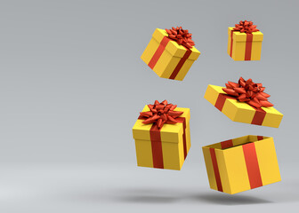 Gift boxes with ribbon and bow for Merry Christmas flying and falling on grey