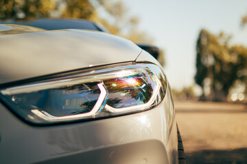 Side view of the auto.Rear headlight of the car.Outside the car.Rent a car.Driving...