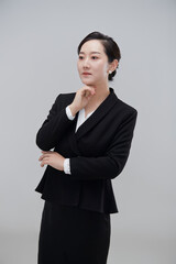 Asian businesswoman in front of a white background