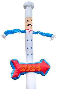 inflatable chef doll blowing in the wind with 2024 Happy New Year made from chain links