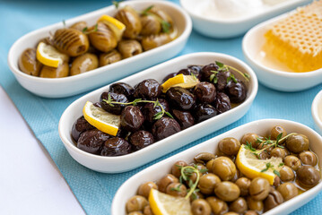 Three different types of olives placed on a traditional Turkish breakfast table