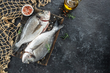 fresh fish with lemon and rosemary. Sea food dinner. place for text, top view