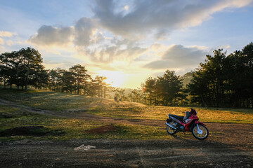 Motorcycle on Hill at Sunrise
A lone motorcycle rests on a hill, bathed in the soft light of dawn. The serenity of morning meets the thrill of the ride.