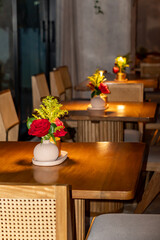 interior of a restaurant in hotel with bouquet of roses and flowers 