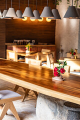 interior of a restaurant in hotel with bouquet of roses and flowers 