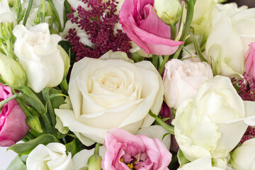 White rose among the other flowers, fragment of the bouquet