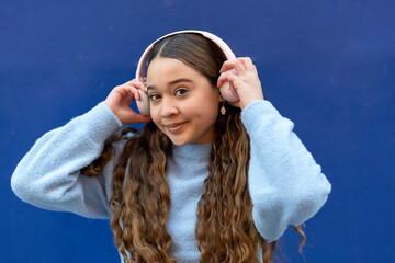 young girl using her headphones