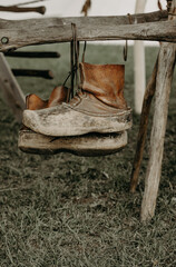 boots on a fence