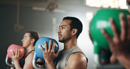 Gym, group fitness and kettlebell squat exercise for power, sports challenge and muscle. Serious...