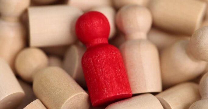 Selecting special employee for manager red figurine. Not like everyone else