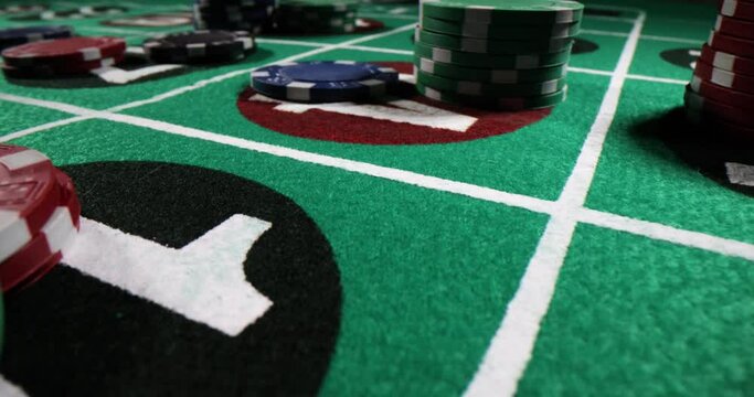 Green casino roulette table with chips. Roulette game and bets