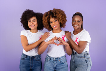 African Ladies With Breast Cancer Ribbons Gesturing Heart, Purple Background