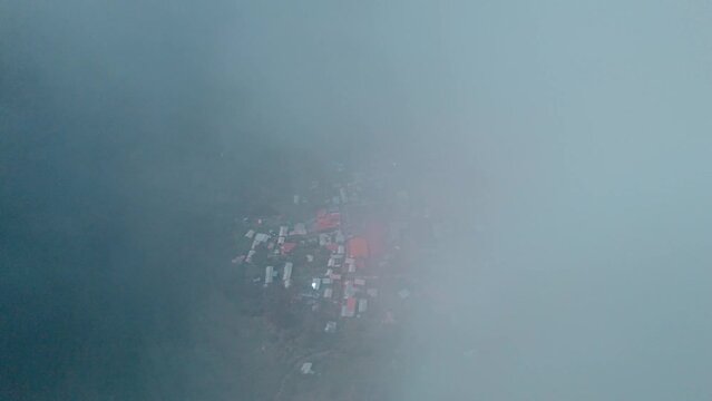 Aerial drone shot from the clouds revealing the picturesque village of Tapay in the Colca Valley. Breathtaking high-altitude perspective capturing the charm of this Andean village.