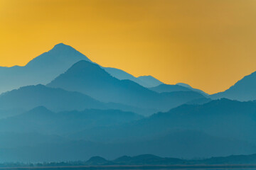 First light of the morning in the foggy mountains