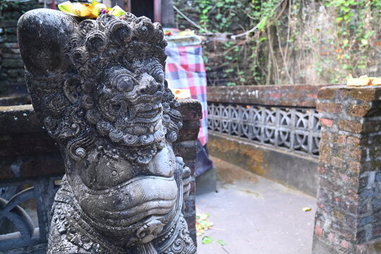 Traditional old ancient Balinese mask demon angel guarding sacred ritual temple