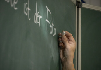 hand writing on a blackboard