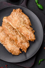 Delicious fried chicken chop or pork meat fried breaded with salt, spices and herbs