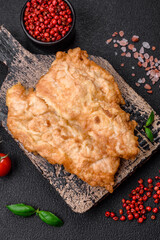 Delicious fried chicken chop or pork meat fried breaded with salt, spices and herbs