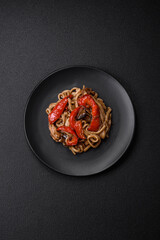 Delicious asian udon dish with vegetables, mushrooms, salt and spices