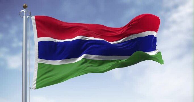 National flag of the Gambia waving in the wind on a clear day