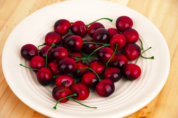 Cherries isolated on wooden table