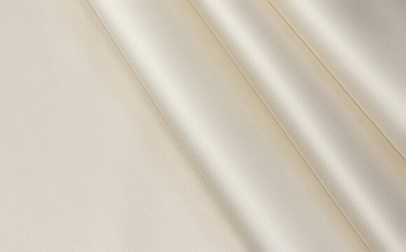 Linen textured ivory color silk fabric. Tissue concept background for design