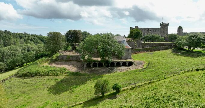 An old-world castle set against a picturesque rural landscape in Ireland 4k