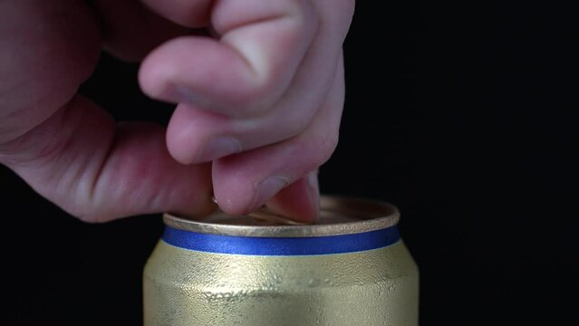 Hand Open A Can Of Beer, Black Background, Close-up