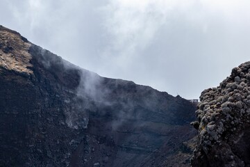 Aerial view of of volcano crater surrounded by rocks