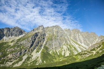 Fototapeta premium Aerial view of mountain landscape with growing grass