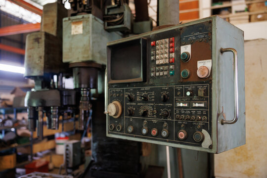 old cnc control panel with monitor and keyboard. concept : replacement old technology machine, obsolete machine system.