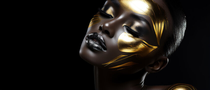  Beauty woman painted in black skin color body, gold makeup, lips, eyelids in gold color paint