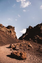 Landscape view of the Volcanic vineyards with hills and mountains in the background