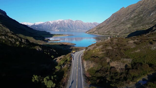 Wanaka, New Zealand: Aerial drone footage of the neck between lake Wanaka and lake Hawea in New Zealand south island. Shot with an upward and tilt down motion