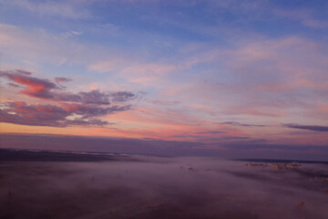 Fototapeta na wymiar Embracing the Morning Sky: Sunrise Above Clouds