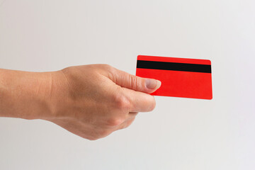 hand holds a bank card. Close-up