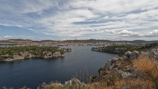 Time-lapse of the Channel of St. Anthony near Sibenik, Croatia, against a blue clouded sky