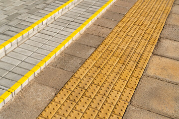 Yellow blocks of tactile paving for blind handicap